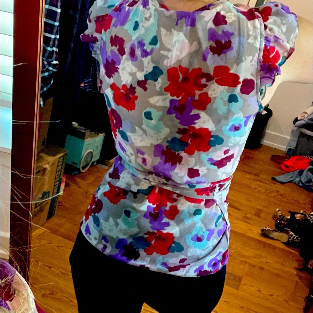 Great colorful piece! Wrap blouse w/flowery print